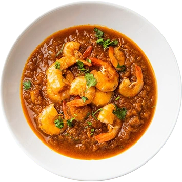 A spicy prawn curry with fresh cilantro served at the best north Indian restaurant.